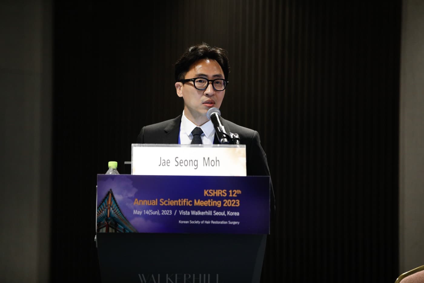 Photograph related to a speaker presentation at the 12th KSHRS Scientific Meeting